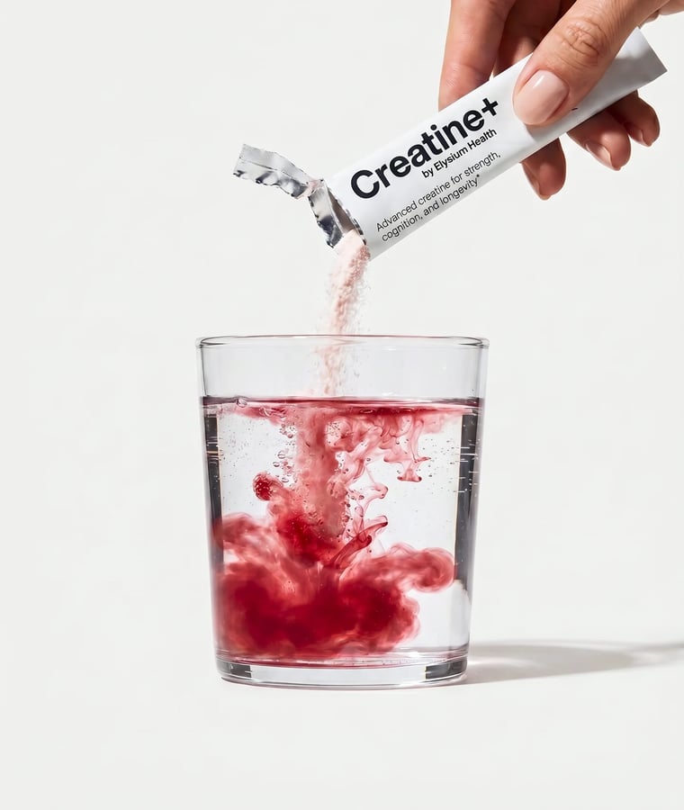 A serving of Creatine+ being stirred into a glass of water